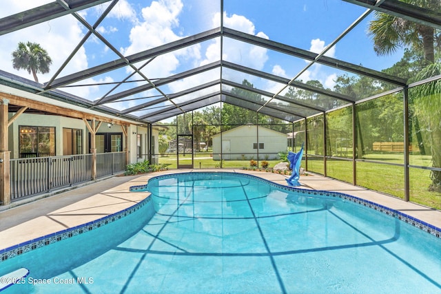 2150 Winston Dr, Cocoa, FL 32926 - swimming pool featuring a patio area, glass enclosure, and a yard