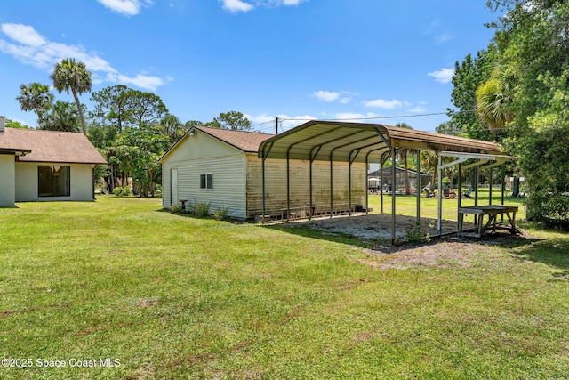 2150 Winston Dr, Cocoa, FL 32926 - view of green lawn with a detached carport