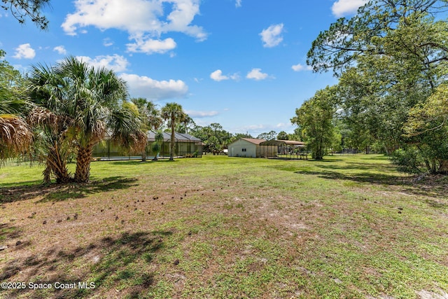 2150 Winston Dr, Cocoa, FL 32926 - view of green lawn featuring a carport
