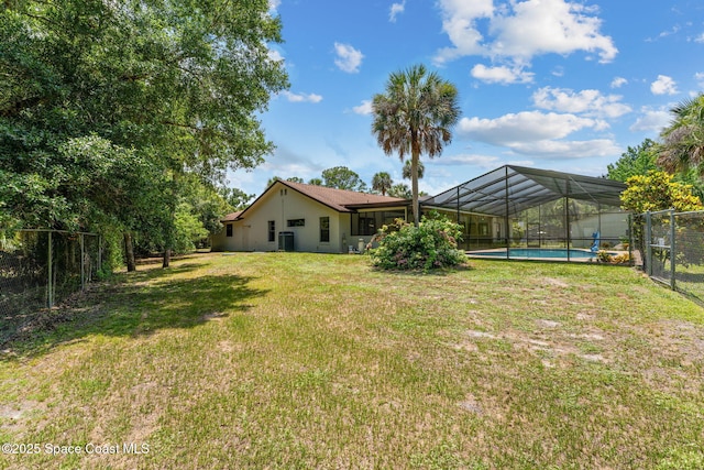 2150 Winston Dr, Cocoa, FL 32926 - view of yard featuring an outdoor pool and a lanai