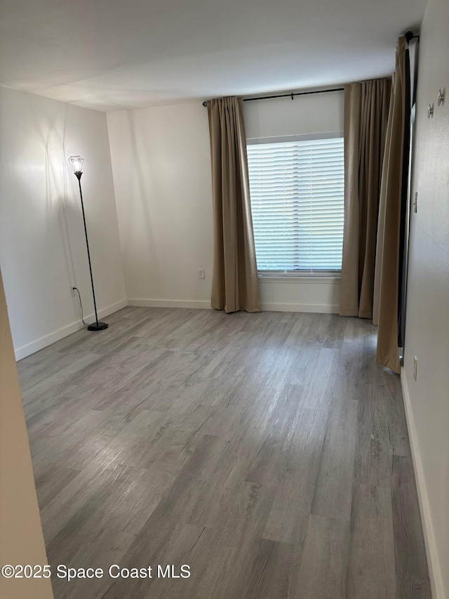1515 Huntington Ln Unit 915, Rockledge, FL 32955 - empty room with wood finished floors and baseboards