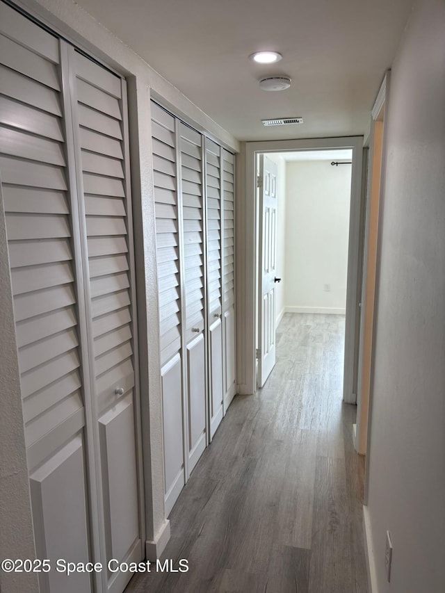 1515 Huntington Ln Unit 915, Rockledge, FL 32955 - corridor featuring wood finished floors and baseboards