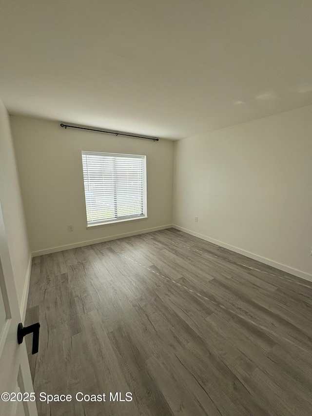 1515 Huntington Ln Unit 915, Rockledge, FL 32955 - empty room featuring wood finished floors and baseboards