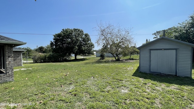 741 Pebble Ave NE, Palm Bay, FL 32907 - view of grassy yard with a storage shed