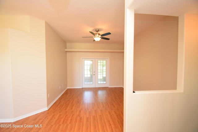 741 Pebble Ave NE, Palm Bay, FL 32907 - empty room with light wood finished floors, a ceiling fan, and french doors
