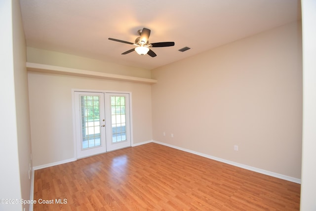 741 Pebble Ave NE, Palm Bay, FL 32907 - unfurnished room with light wood-type flooring, french doors, and ceiling fan