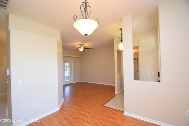 741 Pebble Ave NE, Palm Bay, FL 32907 - spare room featuring a ceiling fan and light wood-type flooring