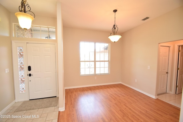741 Pebble Ave NE, Palm Bay, FL 32907 - entrance foyer with baseboards and light wood-style floors
