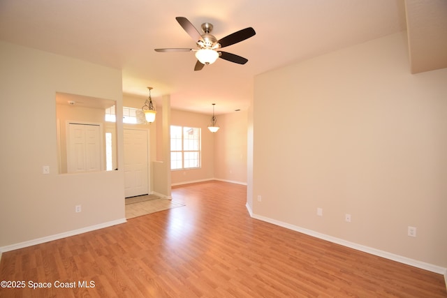 741 Pebble Ave NE, Palm Bay, FL 32907 - spare room with light wood-style floors and a ceiling fan