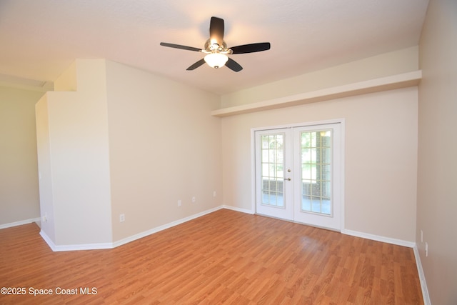 741 Pebble Ave NE, Palm Bay, FL 32907 - empty room featuring french doors, light wood finished floors, and a ceiling fan