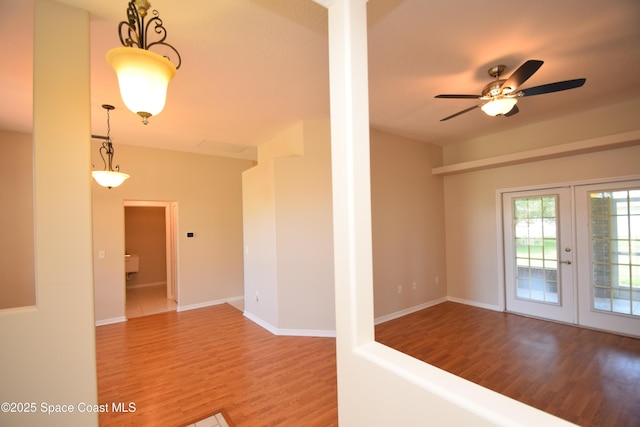 741 Pebble Ave NE, Palm Bay, FL 32907 - empty room featuring wood finished floors, french doors, and ceiling fan