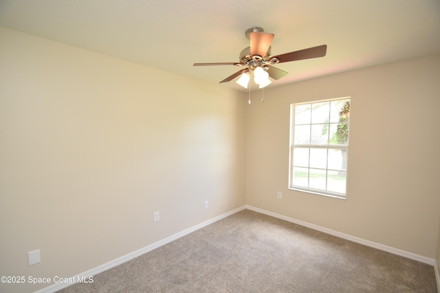 741 Pebble Ave NE, Palm Bay, FL 32907 - carpeted empty room with baseboards and ceiling fan