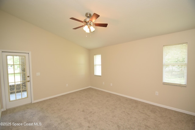 741 Pebble Ave NE, Palm Bay, FL 32907 - unfurnished room with light carpet, a ceiling fan, plenty of natural light, and vaulted ceiling