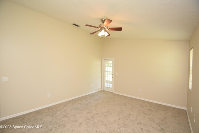 741 Pebble Ave NE, Palm Bay, FL 32907 - unfurnished room featuring vaulted ceiling, ceiling fan, and light carpet
