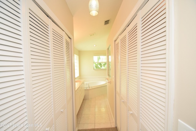 741 Pebble Ave NE, Palm Bay, FL 32907 - corridor featuring light tile patterned floors