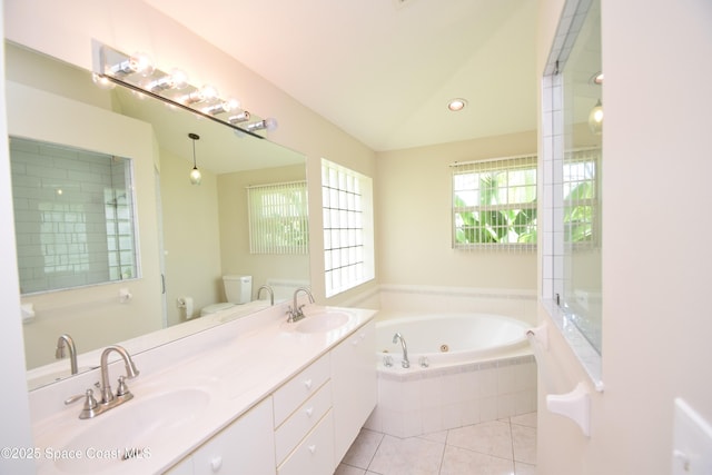 741 Pebble Ave NE, Palm Bay, FL 32907 - bathroom featuring a tub with jets, double vanity, and tile patterned flooring