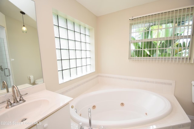 741 Pebble Ave NE, Palm Bay, FL 32907 - bathroom featuring a whirlpool tub, vanity, plenty of natural light, and a shower with door