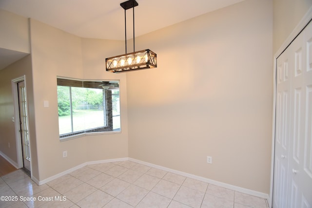741 Pebble Ave NE, Palm Bay, FL 32907 - unfurnished dining area with baseboards and light tile patterned floors