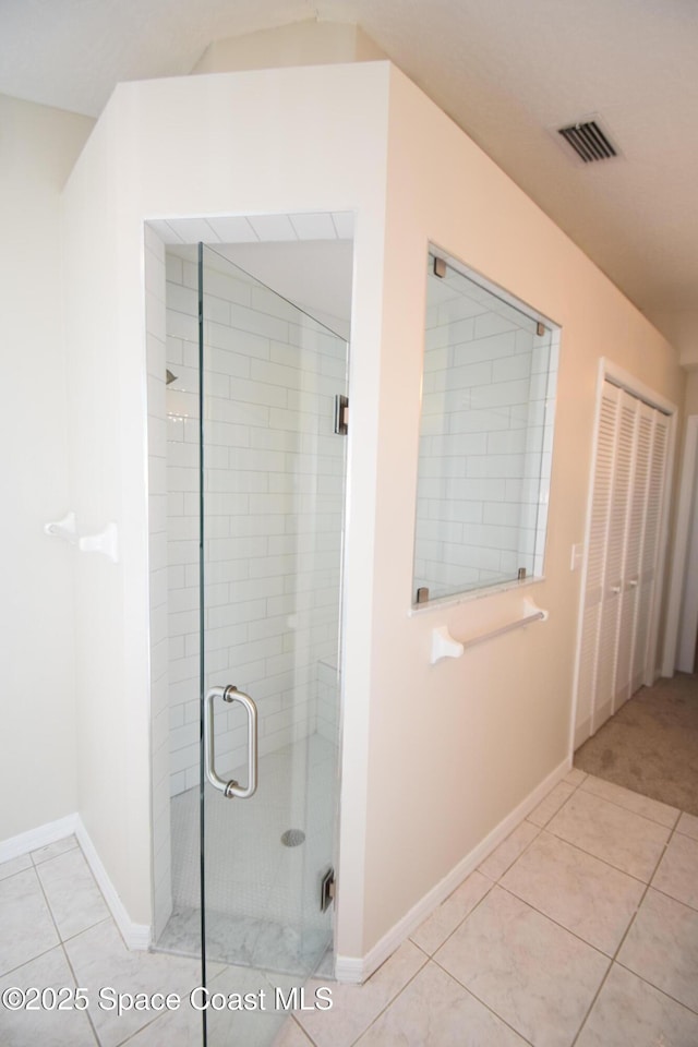 741 Pebble Ave NE, Palm Bay, FL 32907 - full bathroom featuring a shower stall and tile patterned flooring