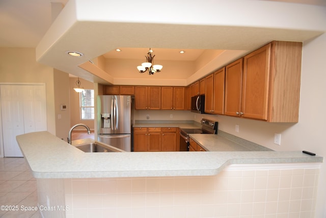 741 Pebble Ave NE, Palm Bay, FL 32907 - kitchen featuring stainless steel appliances, light countertops, a chandelier, light tile patterned flooring, and recessed lighting