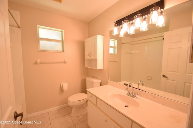 741 Pebble Ave NE, Palm Bay, FL 32907 - full bathroom with vanity, tile patterned flooring, and a shower