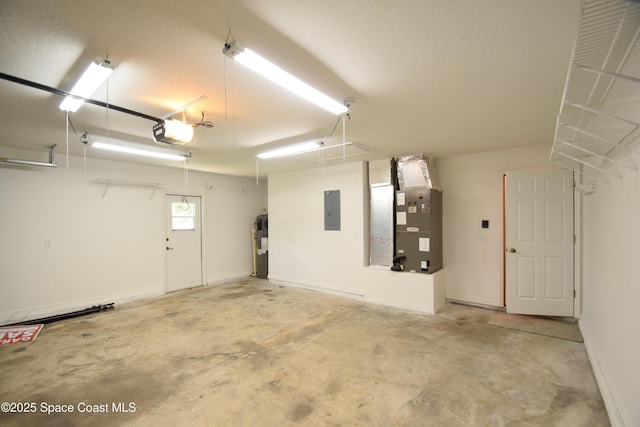 741 Pebble Ave NE, Palm Bay, FL 32907 - garage with electric panel, a garage door opener, heating unit, and electric water heater