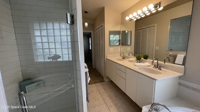 741 Pebble Ave NE, Palm Bay, FL 32907 - full bath featuring double vanity, tile patterned flooring, and a tub to relax in