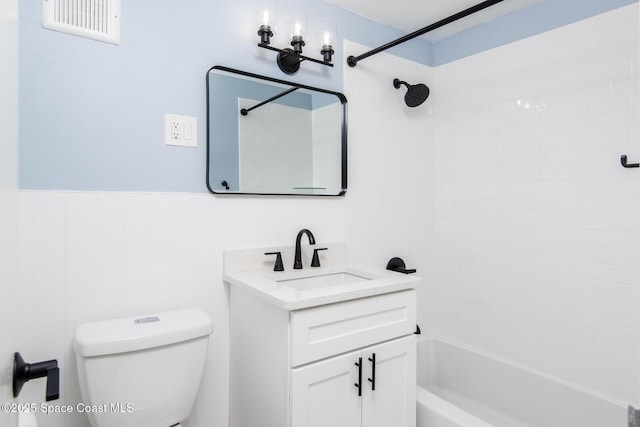 55 Sea Park Blvd Unit 206, Satellite Beach, FL 32937 - full bathroom with vanity, washtub / shower combination, and a wainscoted wall