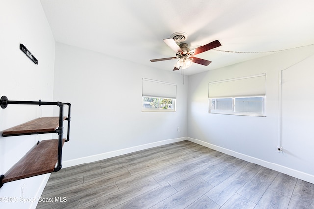 1384 Rosemary Dr, Melbourne, FL 32935 - empty room with ceiling fan and wood finished floors