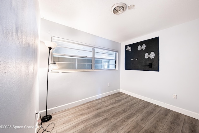 1384 Rosemary Dr, Melbourne, FL 32935 - unfurnished room featuring wood finished floors and baseboards
