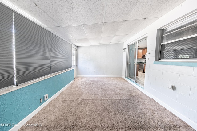1384 Rosemary Dr, Melbourne, FL 32935 - carpeted empty room with a drop ceiling and baseboards