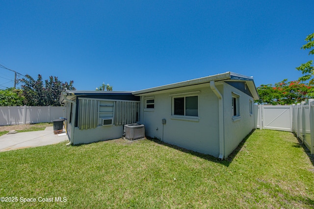 1384 Rosemary Dr, Melbourne, FL 32935 - back of property with a fenced backyard, a patio area, and a gate