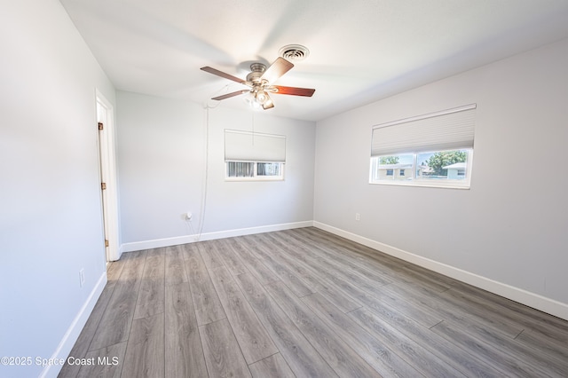 1384 Rosemary Dr, Melbourne, FL 32935 - unfurnished room featuring wood finished floors and a ceiling fan