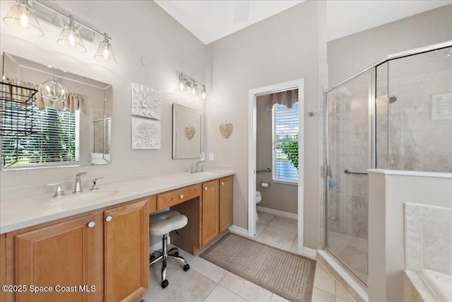 1350 Tamango Dr, Melbourne, FL 32904 - bathroom with double vanity, a stall shower, tile patterned flooring, tiled tub, and a chandelier