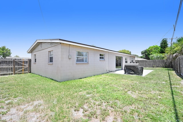 1426 Floyd Dr, Rockledge, FL 32955 - rear view of property featuring a fenced backyard and a patio area