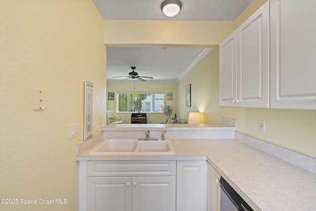 605 Ocean Park Ln Unit V235, Cape Canaveral, FL 32920 - kitchen with light countertops, white cabinets, a ceiling fan, crown molding, and a textured wall