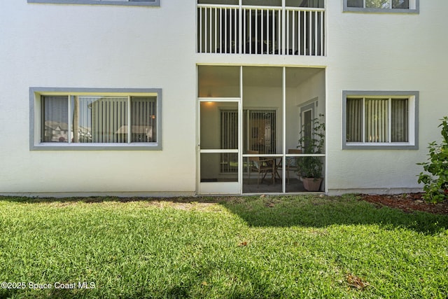 605 Ocean Park Ln Unit V235, Cape Canaveral, FL 32920 - rear view of property with stucco siding and a yard