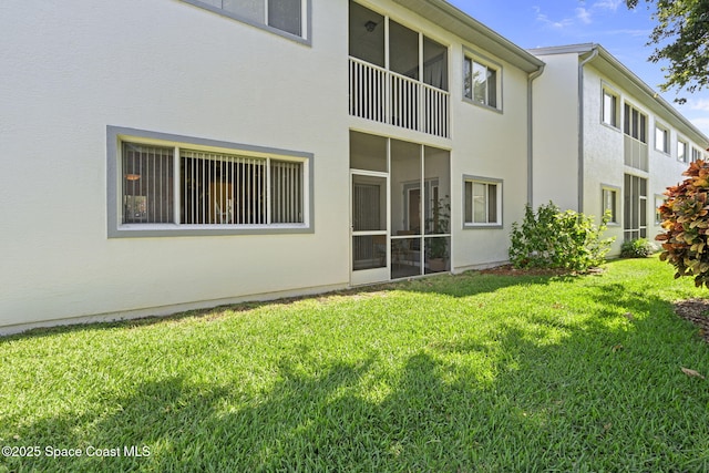605 Ocean Park Ln Unit V235, Cape Canaveral, FL 32920 - back of property featuring stucco siding and a yard