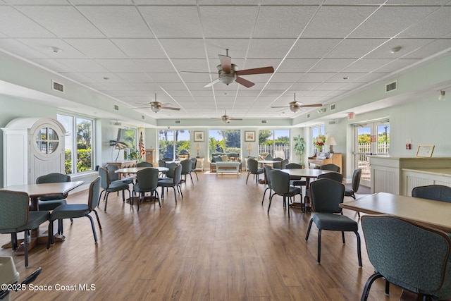 605 Ocean Park Ln Unit V235, Cape Canaveral, FL 32920 - dining room featuring a paneled ceiling, wood finished floors, and healthy amount of natural light