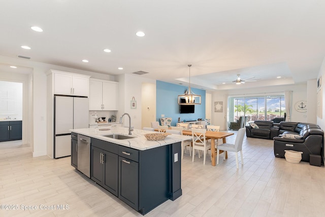 9124 Corvo Ct, Melbourne, FL 32940 - kitchen featuring open floor plan, white cabinetry, recessed lighting, dishwasher, and ceiling fan