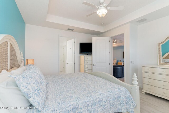 9124 Corvo Ct, Melbourne, FL 32940 - bedroom featuring light wood-type flooring and ceiling fan