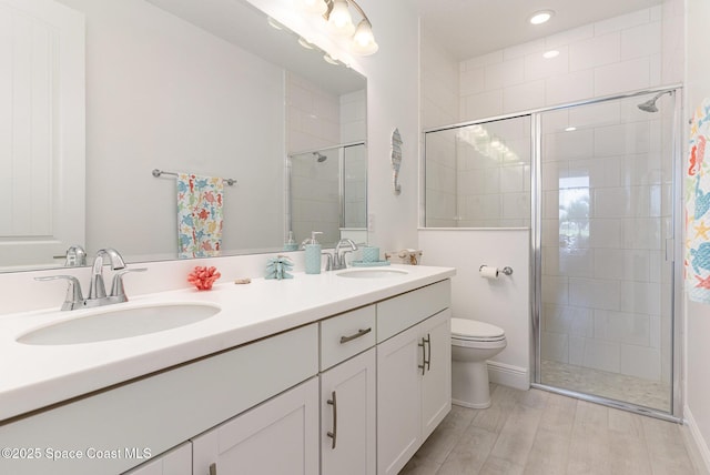 9124 Corvo Ct, Melbourne, FL 32940 - bathroom featuring a stall shower, double vanity, and recessed lighting