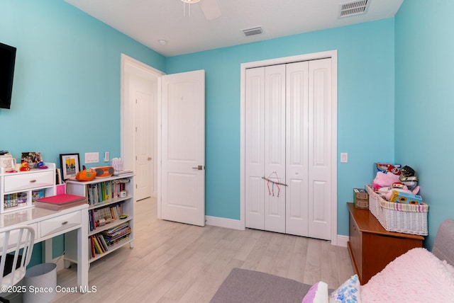 9124 Corvo Ct, Melbourne, FL 32940 - bedroom with wood finished floors, a closet, and a ceiling fan