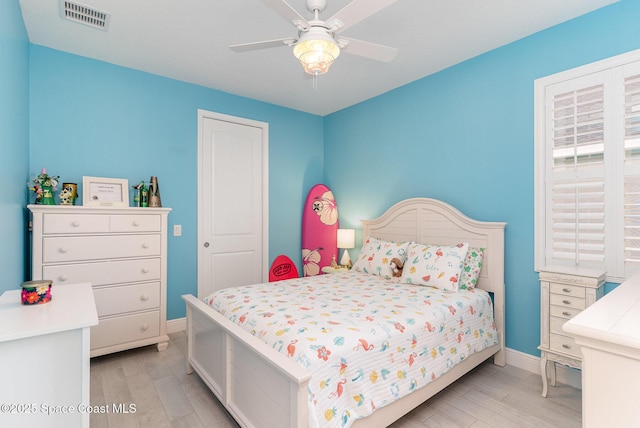 9124 Corvo Ct, Melbourne, FL 32940 - bedroom with light wood-style flooring and a ceiling fan
