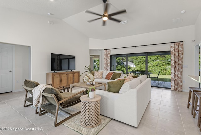 1011 Eldron Blvd SE, Palm Bay, FL 32909 - living area with light tile patterned flooring, ceiling fan, and vaulted ceiling