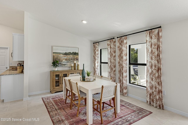 1011 Eldron Blvd SE, Palm Bay, FL 32909 - dining space with light tile patterned flooring, a textured ceiling, and recessed lighting