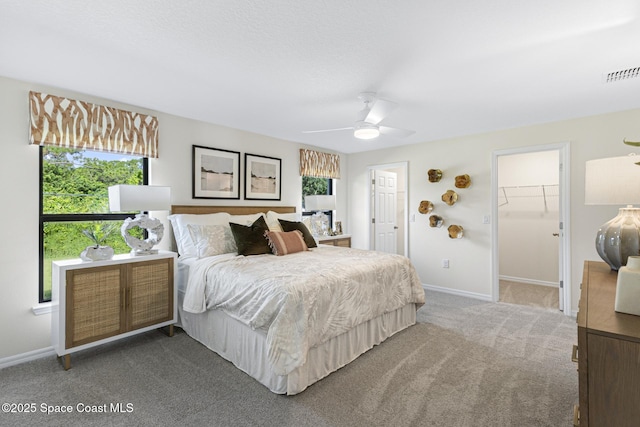 1011 Eldron Blvd SE, Palm Bay, FL 32909 - bedroom featuring carpet flooring, ceiling fan, and a walk in closet