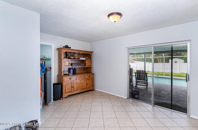 1661 Sandusky St SE, Palm Bay, FL 32909 - empty room with a textured ceiling and baseboards