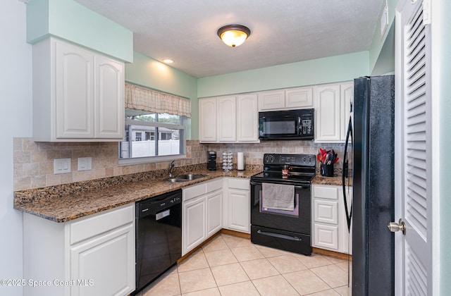 1661 Sandusky St SE, Palm Bay, FL 32909 - kitchen with black appliances, white cabinets, decorative backsplash, and dark stone counters