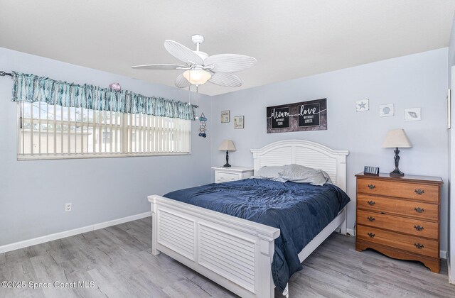 1661 Sandusky St SE, Palm Bay, FL 32909 - bedroom with wood finished floors and ceiling fan